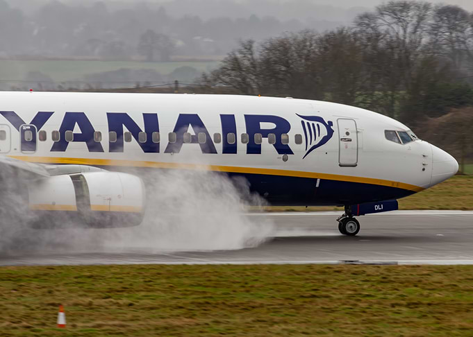 Ryanair plane on wet runway