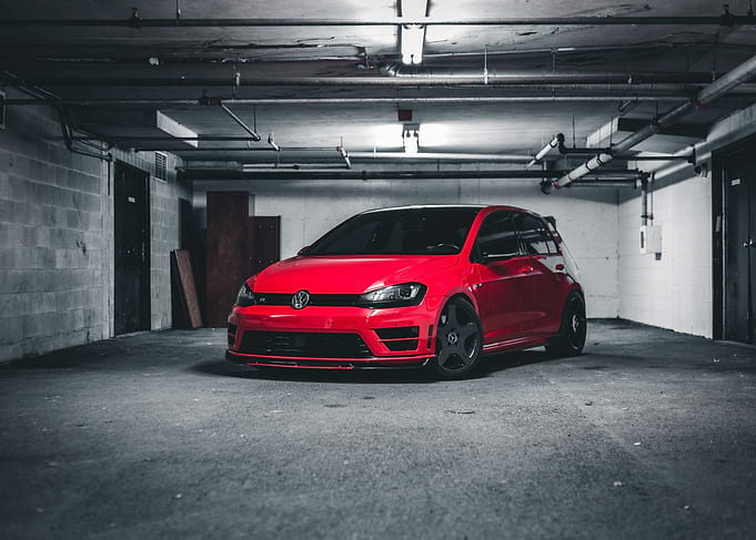 Red Volkswagen Golf R in Garage
