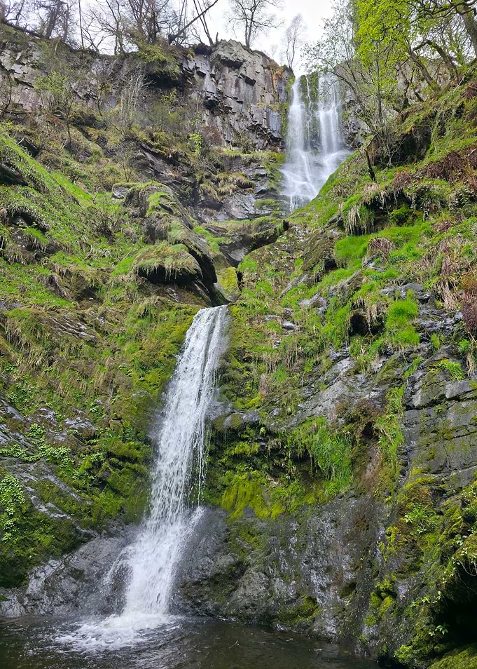 Waterfall cascading down mossy rocks
