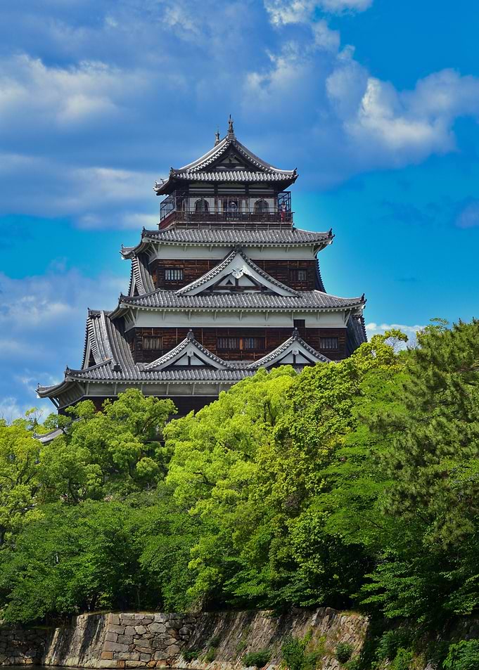 Japanese Castle Surrounded by Lush Greenery