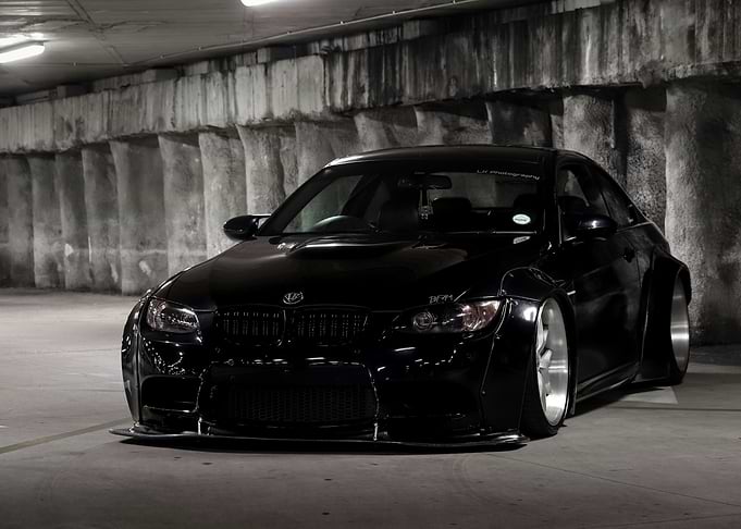 Sleek Black Modified Car in Garage