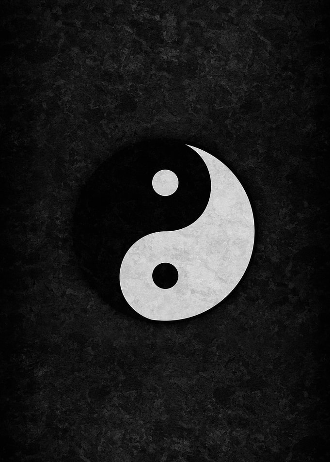 Yin and Yang Symbol on Dark Texture