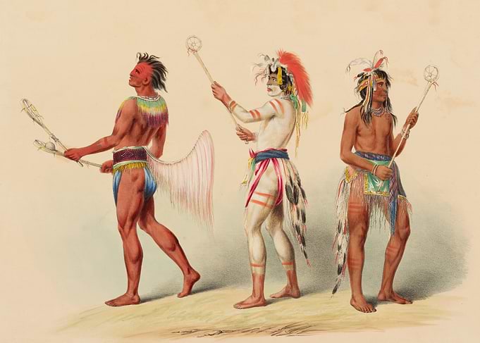 Native American men with lacrosse sticks