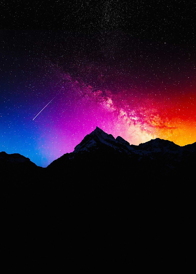 Mountain Silhouette Under Colorful Starry Sky