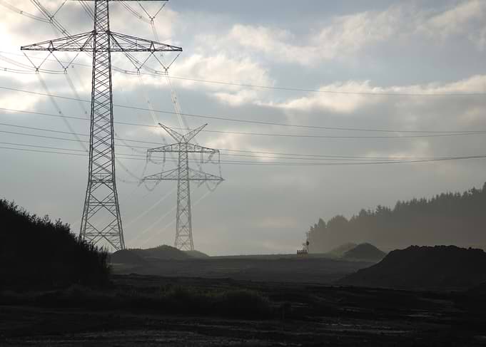 Power Lines in a Misty Landscape
