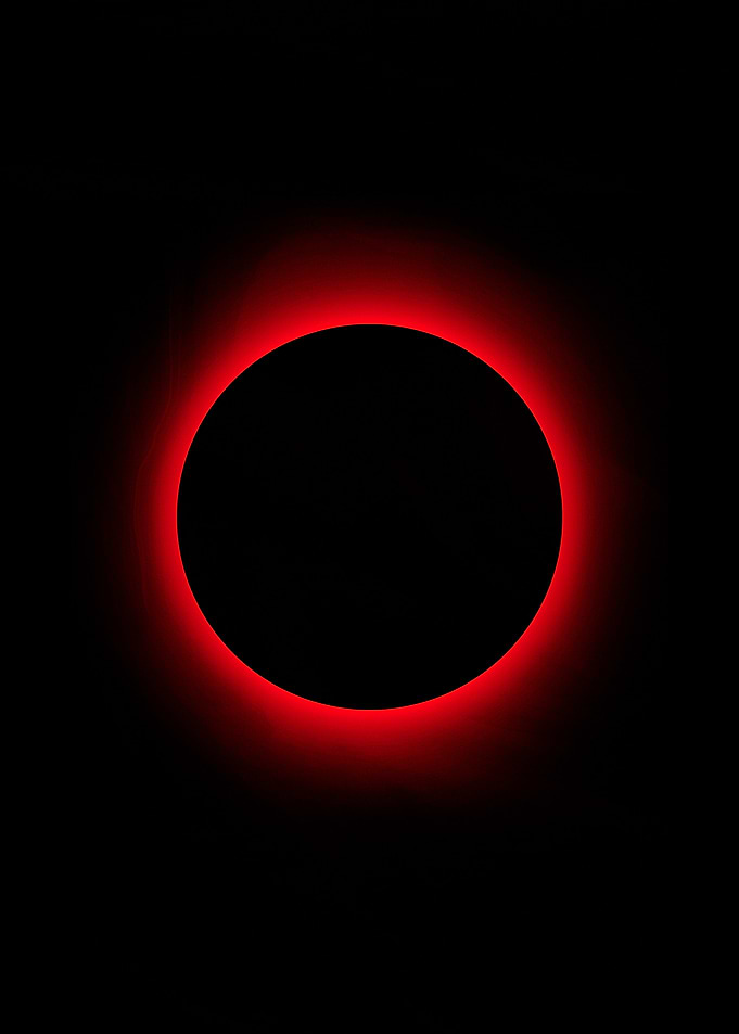 Red Ring Eclipse on Black Background
