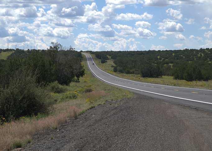 Road to the Grand Canyon through a green landscape