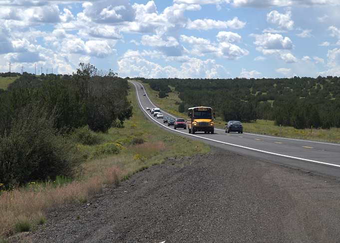 Road to Grand Canyon with School Bus and Cars