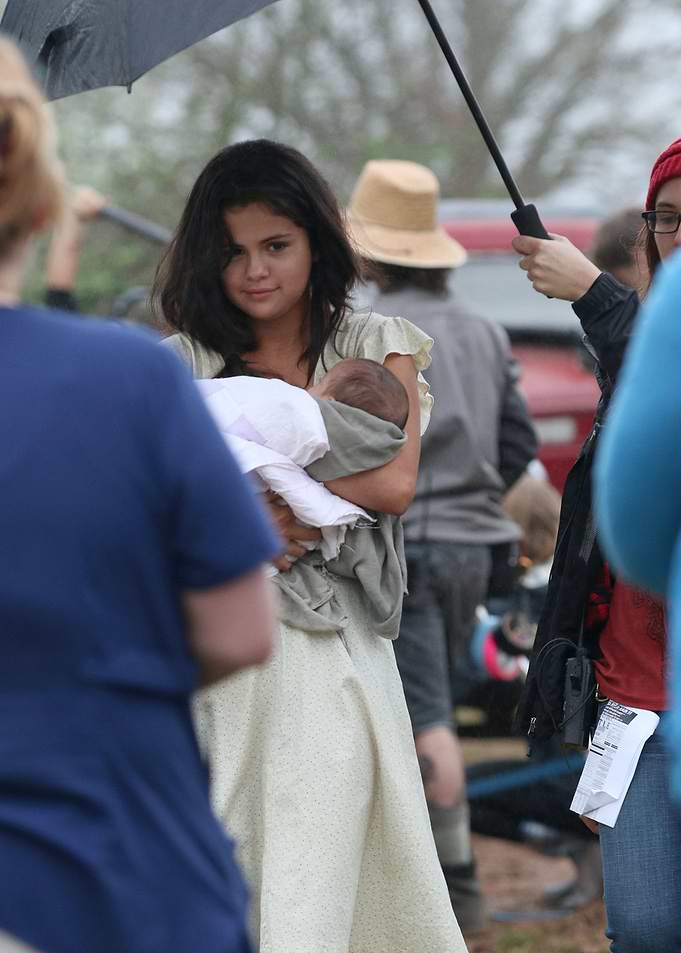 Selena Gomez Holding Baby on Set