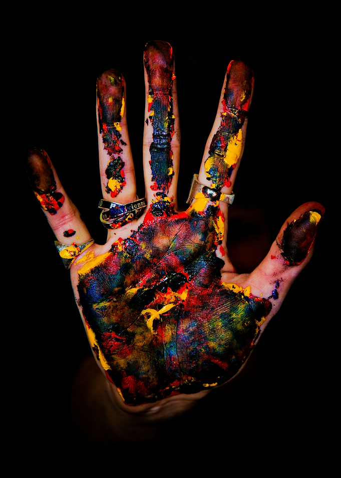 Colorful Handprint on Black Background