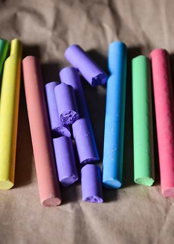 Colorful Chalk Sticks on Brown Paper