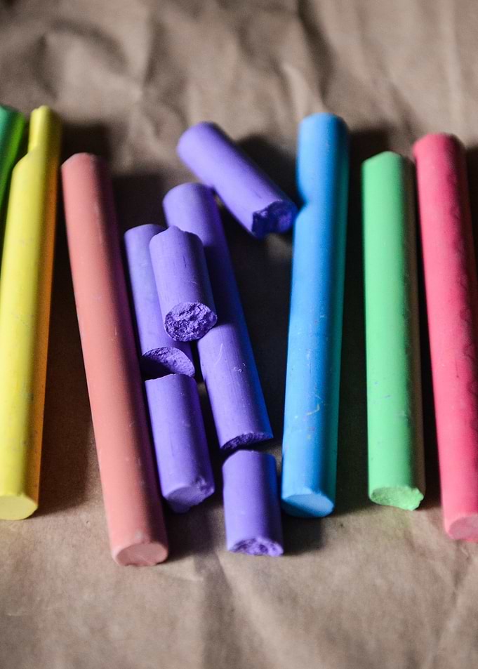 Colorful Chalk Sticks on Brown Paper