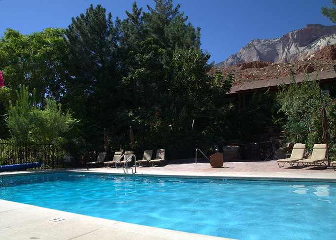 Swimming pool with Zion National Park mountain backdrop