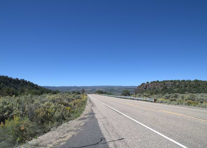 Desert Road Under a Clear Blue Sky