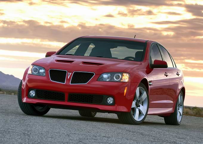 Red Pontiac G8 on Asphalt Road