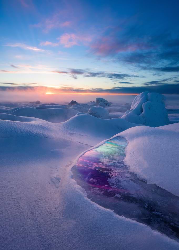Winter landscape with colorful ice