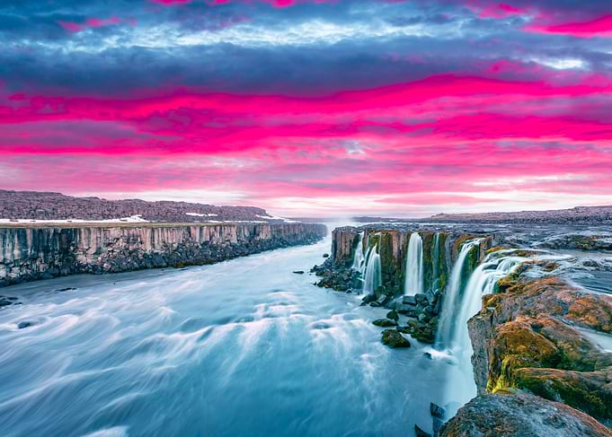 Dramatic Waterfall Landscape with Pink Sky