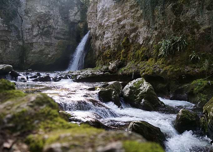 Waterfall and Stream in Rocky Landscape