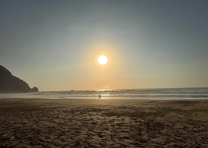 Beach Sunset with Silhouetted Figures