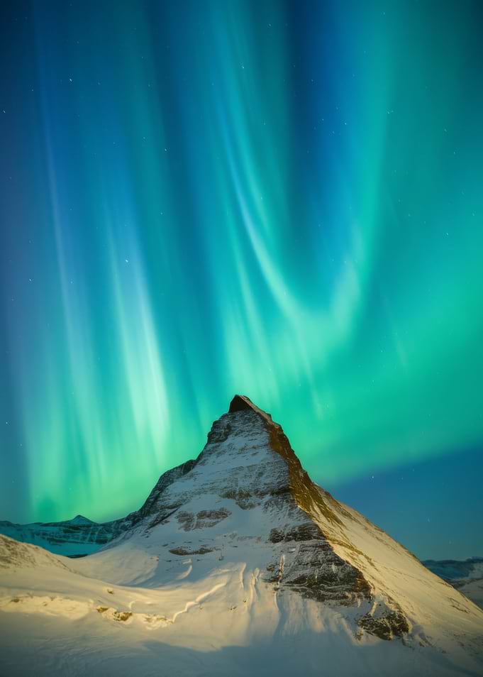 Aurora Borealis over Snowy Mountain Peak
