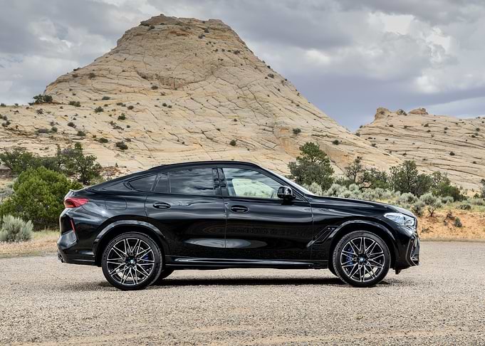 Black BMW X6 in Desert Landscape