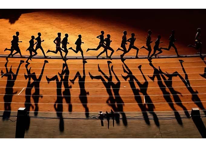 Runners' Silhouettes and Shadows on Track