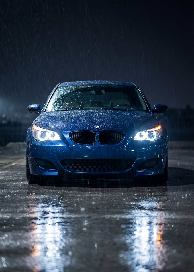 Blue BMW E60 in the Rain