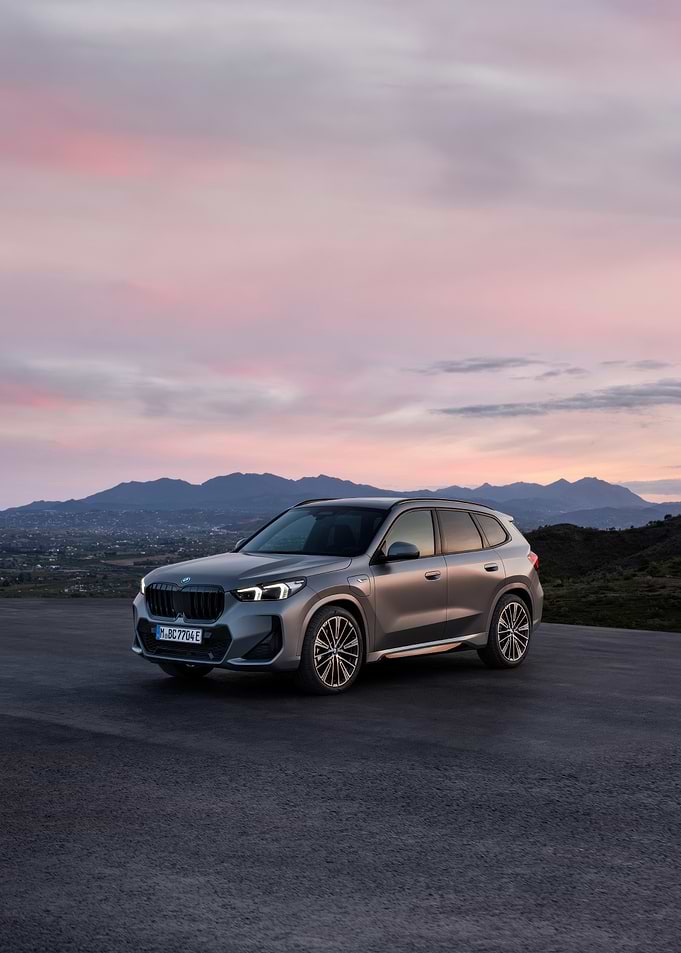 Silver BMW X1 SUV at Sunset