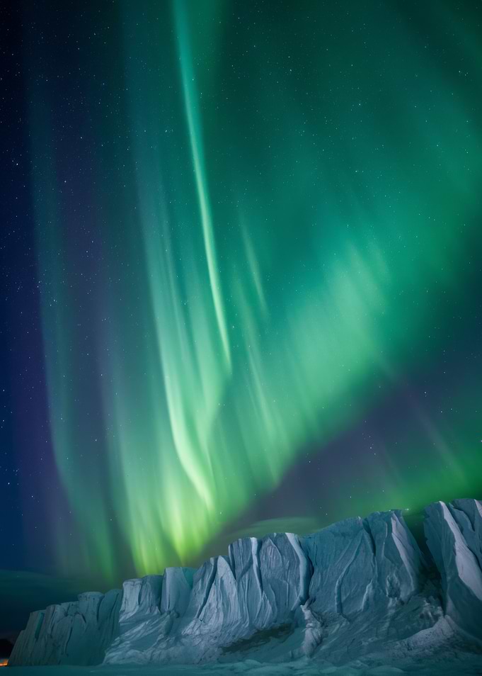 Aurora Borealis over icy landscape