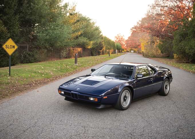 Blue BMW M1 on Road