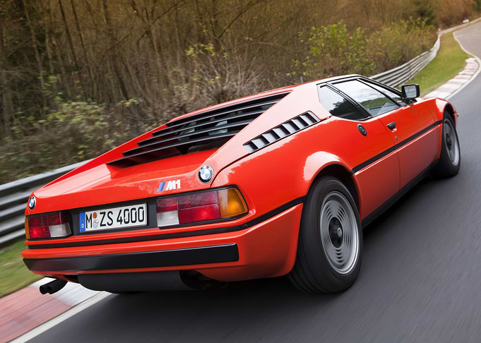Red BMW M1 on Racetrack