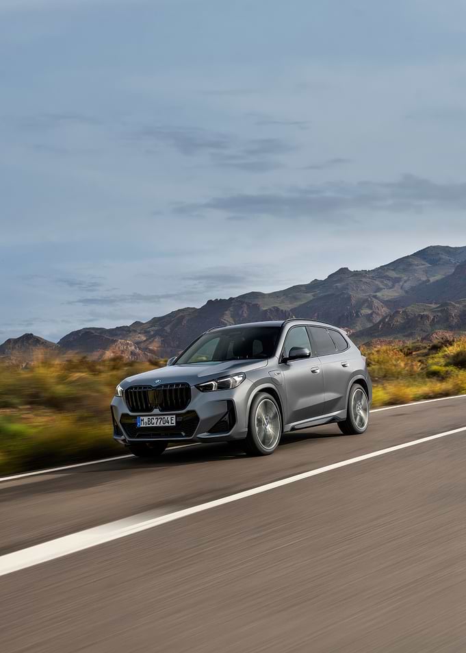 Silver BMW X1 on Open Road