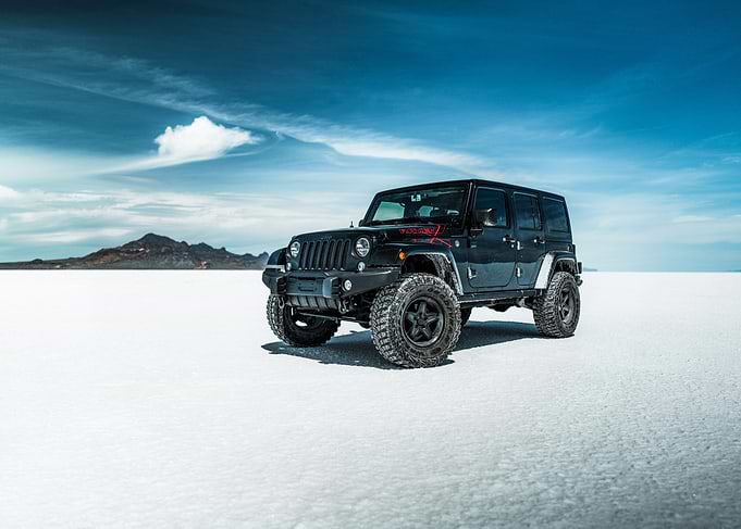 Black Jeep Wrangler on Salt Flats