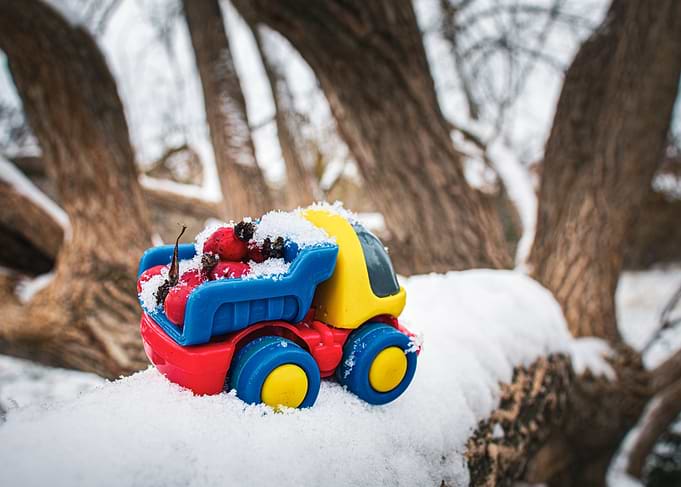 Toy truck in winter landscape