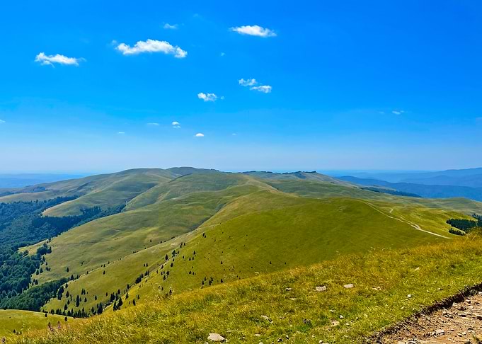 Green Hills Under Blue Sky