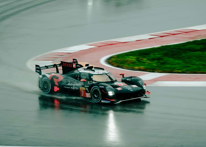 Racing car on a wet track