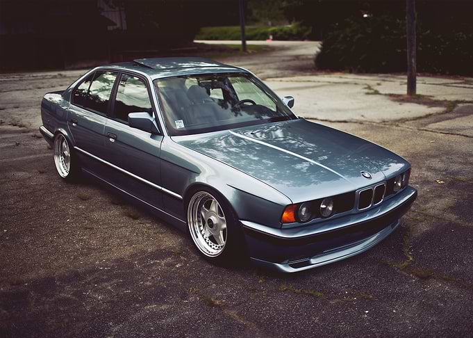 Blue BMW E34 on Asphalt