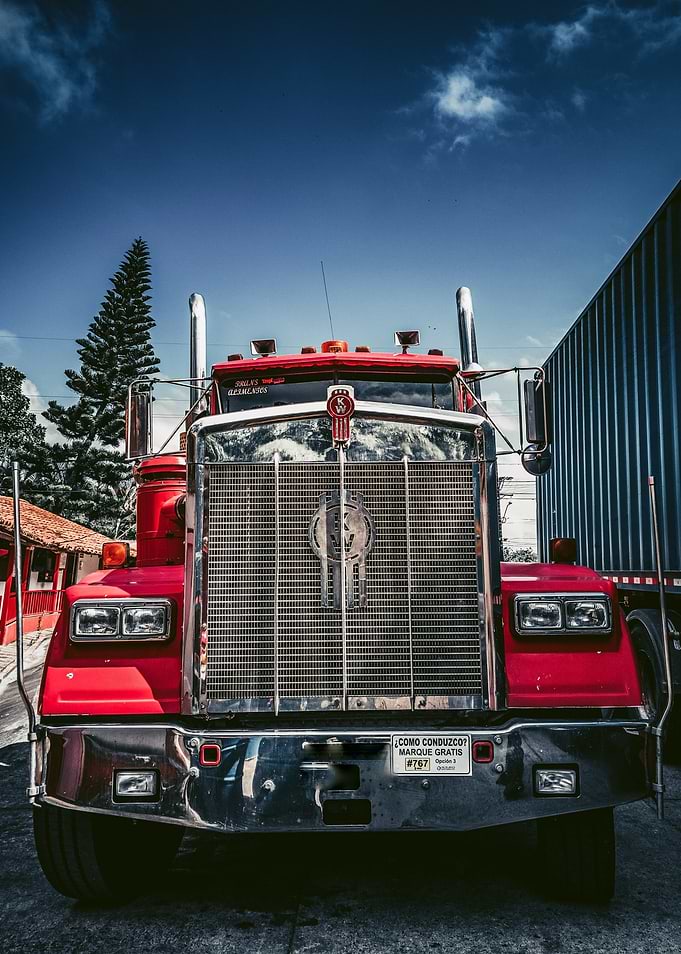 Red Kenworth Truck Under Blue Sky