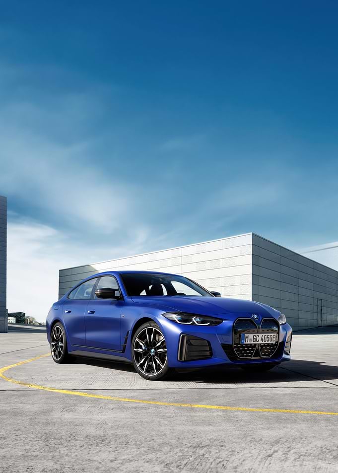 Blue BMW i4 on Concrete Surface