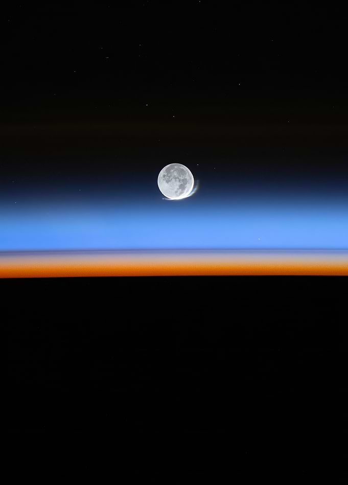 Moon Over Earth's Atmospheric Glow
