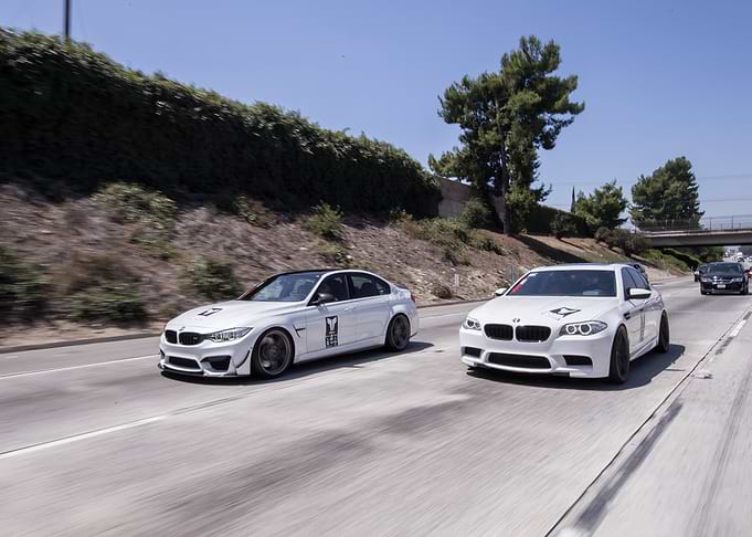 White BMW Cars on Highway