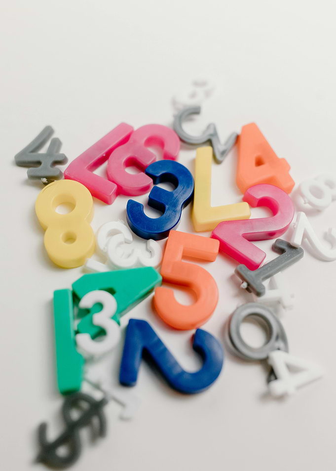 Colorful Plastic Numbers on White Background