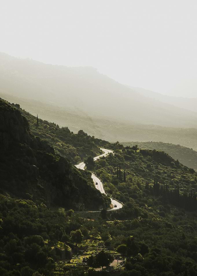 Winding Mountain Road with Cars