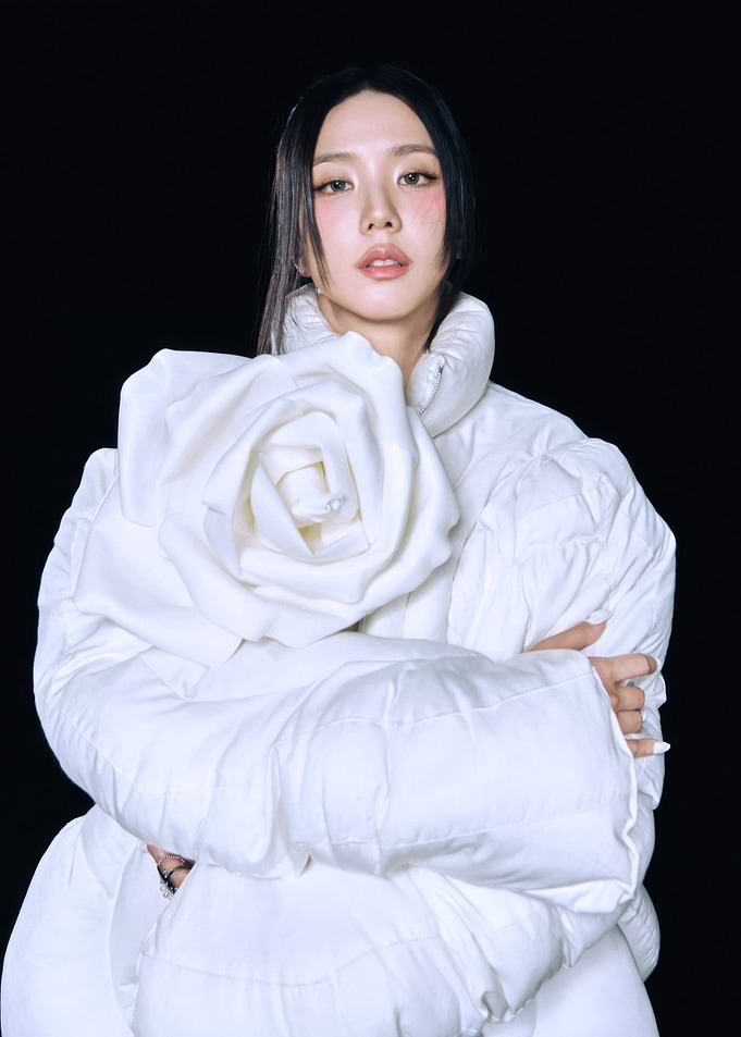 Woman in White Rose Puffer Jacket