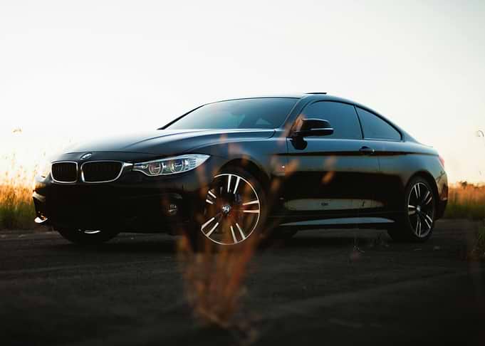Sleek Black BMW Coupe at Sunset