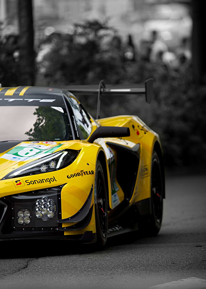 Yellow Race Car on Asphalt Road