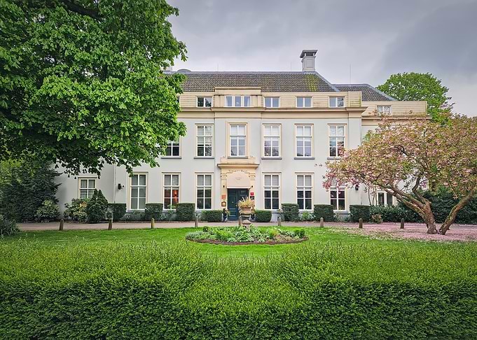 Elegant Mansion with Lush Greenery