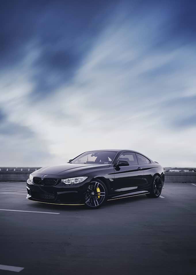 Black BMW Coupe on Rooftop