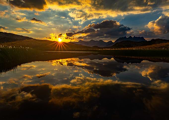 Mountain lake sunset reflection