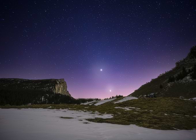 Night Sky Over Snowy Mountains